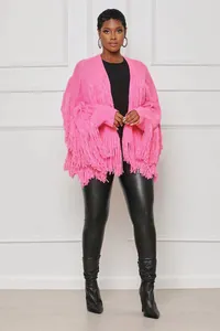 Detailed view of women's pink chunky knit cardigan featuring heavy fringe accents
