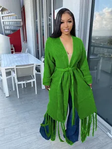 Detailed view of bright green long-line cardigan with fringe hem and waist tie