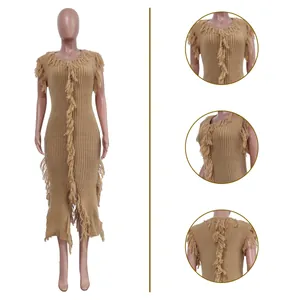 Detail view of sleeveless knitted midi dress with fringe accents in tan color.