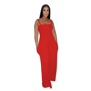 Elegant red wide-leg jumpsuit for women featuring a smocked bodice and thin cami straps