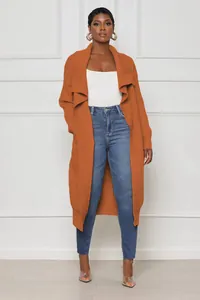 Front view detail of a premium burnt orange long knit cardigan with ribbed texture