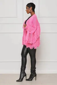 Detailed side view of a vibrant pink knit cardigan with dense fringe for women