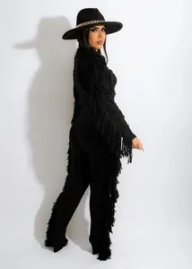 Elegant black knit two-piece set featuring dramatic long fringe details on sleeves and legs