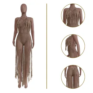 Macro details of beige crochet hollow-out monokini featuring stylish extra long fringes