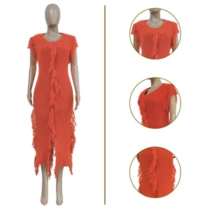 Detailed close-up views showing texture of orange ribbed sleeveless midi dress with fringe accents