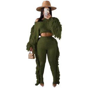 Two-piece olive green knit set with long sleeves and fringe tassels on legs and arms
