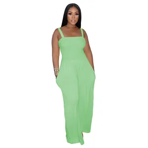 Detailed view of the light green smocked bodice and wide leg cut of the casual jumpsuit