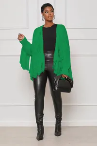 Close-up of vibrant green knit open-front cardigan with stylish layered fringe details