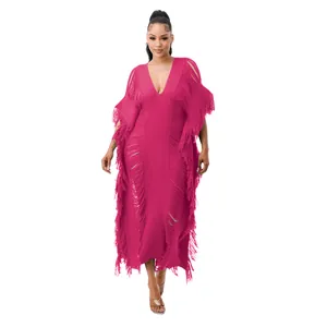 Close-up view of handmade knitted magenta long dress with elegant fringe detailing