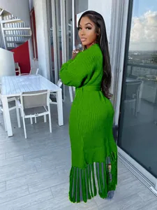 Elegant bright green long knit cardigan featuring stylish tassel hem and balloon sleeves