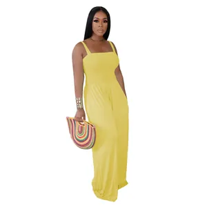 Full body view of a chic yellow strapless wide-leg jumpsuit featuring shirred bodice detail