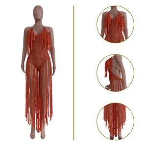 Details of orange hollow knit bodysuit featuring long fringes and crochet texture