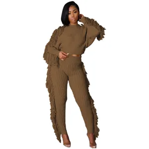 Detailed view of women's brown knitted two-piece set featuring stylish fringe trim accents