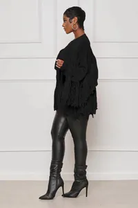 Side view of a stylish black knitted cardigan featuring fringe tassels and long sleeves