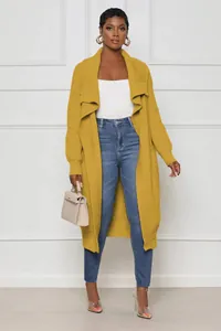 Stylish mustard yellow long knitted cardigan styled with casual jeans and heels.