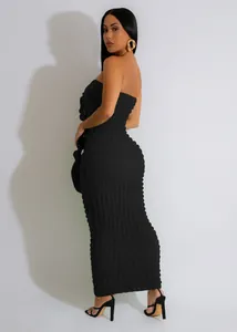 Back view of a black strapless bodycon dress featuring textured bubble fabric