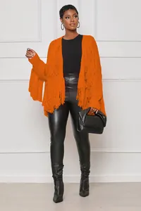 Fashionable orange open front knitted cardigan featuring stylish fringe detail and short length