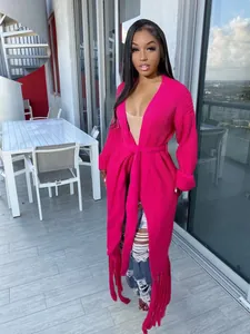 Full-length view of hot pink long cardigan with fringe details and waist tie