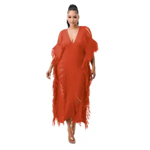Elegant handmade knit fringe maxi dress featuring sheer tassel details and deep V-neck style