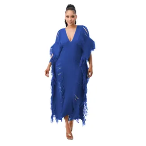 Detailed look at royal blue handmade knit maxi dress with fringe tassels and deep v-neckline