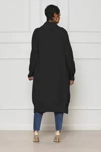 Back view of women's casual solid black long knit cardigan jacket against white wall