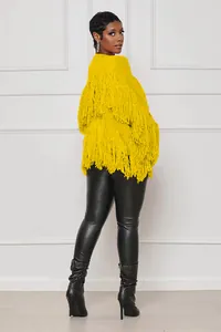 Back view of a yellow knitted fringe cardigan jacket with thick tassels and texture