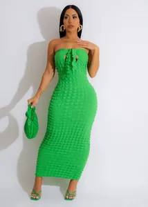 Detail view of vibrant green popcorn fabric strapless maxi dress with matching accessories