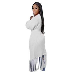 Elegant white long cardigan sweater with long fringe tassel hem detail on model