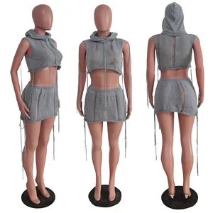 Grey knit sleeveless hooded crop top and mini skirt set with distressed details