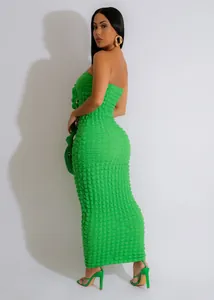 Vibrant green textured bubble cloth strapless bodycon maxi dress shown on a model