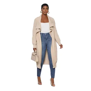 Stylish women's casual solid beige long-sleeved knitted cardigan worn with jeans