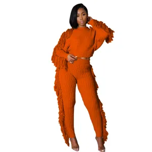 Trendy orange knitted two-piece set with long sleeves and long fringe detailing for women