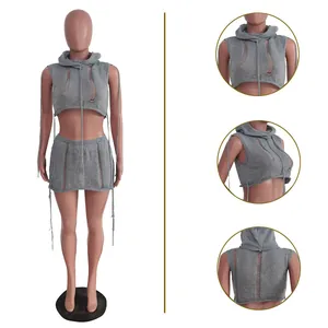 Detailed view of women's grey sleeveless hooded knit crop top and mini skirt set