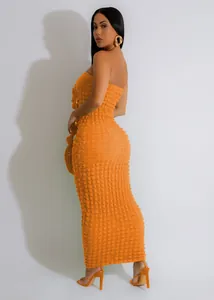 Detailed side view of orange bubble fabric strapless bodycon maxi dress for women
