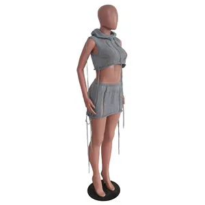 Grey sleeveless hooded knit two-piece set featuring distressed details and mini skirt.