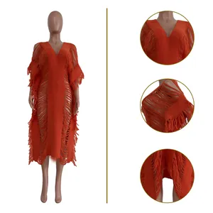 Detailed views of the orange handmade knitted hollow-out long dress with fringe