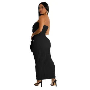 Detailed back view of a sexy black strapless bubble textured bodycon maxi dress
