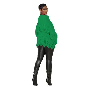 Rear view detail of a vibrant green knitted cardigan featuring tiered fringe design