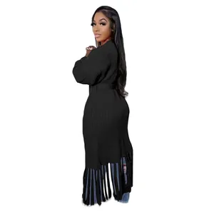 Detailed side view of elegant long black knit cardigan for women with fringe hem