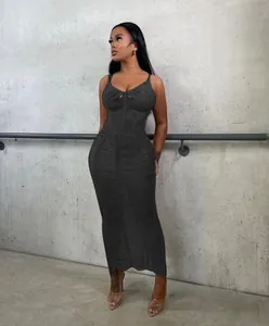 Elegant black knit bodycon maxi dress with chic chest cutout and camisole straps.