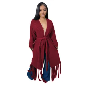 Long burgundy cable-knit cardigan sweater with fringe hem and waist tie detail