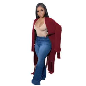 Full-length view of a burgundy long-line cardigan with decorative fringe details