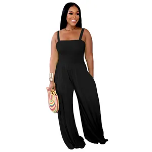 Detailed view of the smocked bodice and wide legs of the black sleeveless jumpsuit