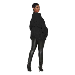Stylish black knit cardigan featuring heavy layered tassel details shown from back view