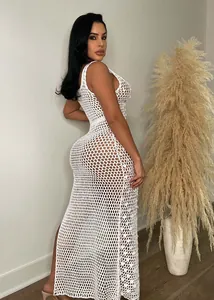 Detailed view of sexy white handmade crochet maxi beach dress with hollow-out sequins