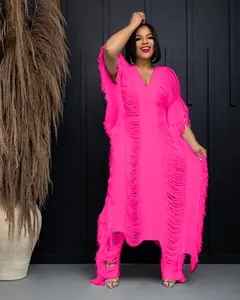 Full-length studio shot of a bright pink handmade crochet hollow-out fringe dress