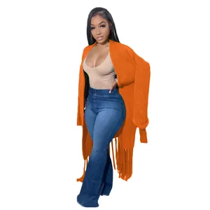 Chic women's long orange knit cardigan sweater featuring stylish tassel fringe hem