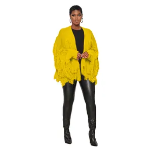 Trendy women's bright yellow knitted short cardigan with heavy fringe and tassels