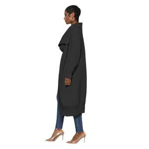 Side view of long black knitted cardigan on model showing length and elegant silhouette.