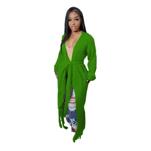 Vibrant green long knitted cardigan featuring decorative fringe hem and adjustable waist tie.